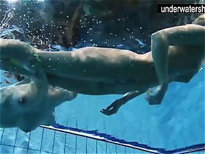 two wondrous amateurs demonstrating their figures off under water